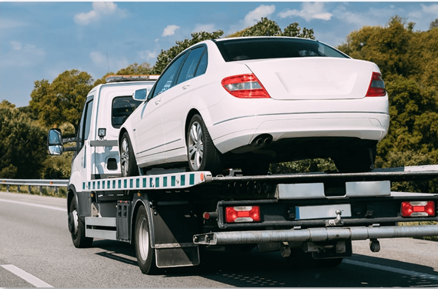 Tow truck carrying a car